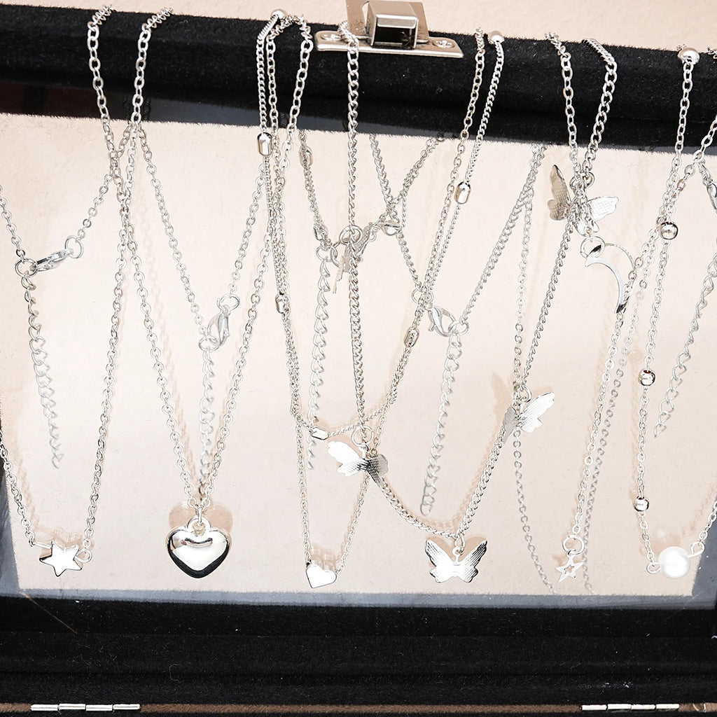 Fashionista’s Dream: 51-Piece Silver Jewelry Set Featuring Pearls and Whimsical Designs