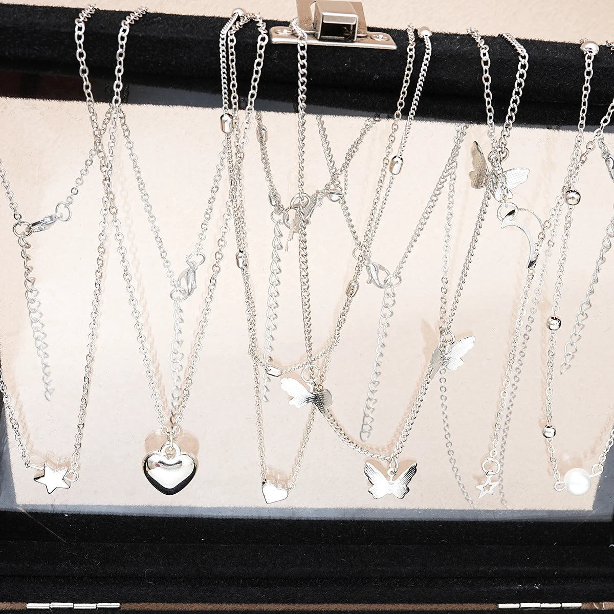 Fashionista’s Dream: 51-Piece Silver Jewelry Set Featuring Pearls and Whimsical Designs